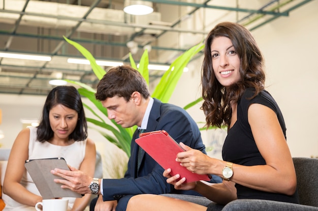 woman-posing-with-tablet-office